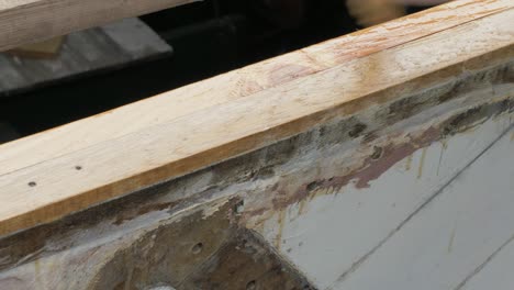 Brushing-epoxy-on-wood-as-protective-coating