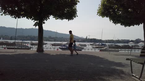 Zurich,-Switzerland---Jun,-2019:-boats-on-Lake-Zurich,-buildings-of-the-city-in-the-background