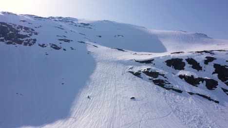 Aerial-view-over-snowy-mountain-landscape