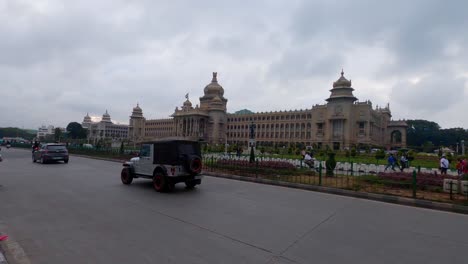 Bangalore,-India---Large-Numbers-Of-Vehicles-Entering-The-Place-Where-The-Vidhana-Souda-Is-Nearly-Located---Wide-Shot