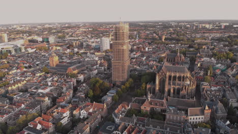 Aerial-view-of-the-city-centre-of-the-Dutch-medieval-city-of-Utrecht-in-The-Netherlands-at-sunrise-with-the-cathedral-tower-in-scaffolds