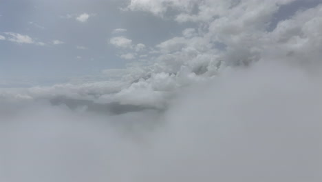 Flight-Over-Clouds-Clear-Cloudy-Sunny-Landscape-Blue-Sky-Mountains-Ecuador-Cajas-National-Park