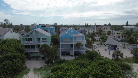 A-blue-coastal-house-sits-on-the-edge-of-paradise,-with-no-one-to-enjoy-it