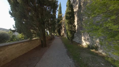 Flight-with-FPV-drone-in-the-garden-of-the-Rocca,-an-ancient-castle-in-upper-Bergamo