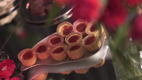 Close-up-of-small-cupcakes-with-red-frosting