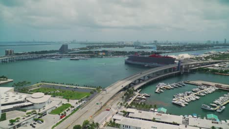 Epic-aerial-view-of-Downtown-Miami-Intercoastal-Ocean-Waterway-with-American-Airlines-Arena-and-Bayside,-Cloudy-Sky