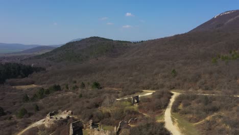 Drone-footage-from-old-castle-ruins-in-Pilisborojeno,-Hungary-Drone-moves-backwards