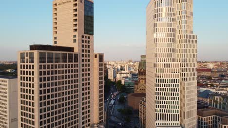 Two-skyscrapers-hotels-church-Mercedes-star
Spectacular-aerial-view-very-close-passing-flight-drone-footage-charlottenburg-sunny-Summer-Evening-2022