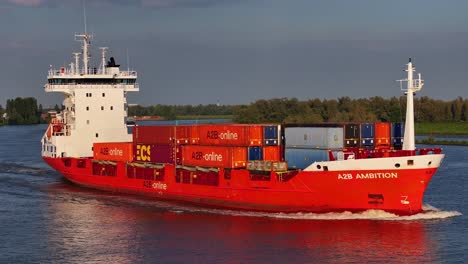 Drone-Closeup-at-colorful-container-ship-sailing-in-water-canal,-Cargo-Vessel-A2B-Ambition