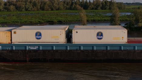 Friendship-Reefer-Vessel-sails-dutch-waters-with-banana-cargo-containers,-transportation