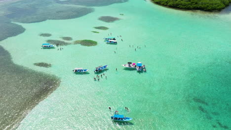 Tourists-And-Boats-On-Clear-Blue-Sea-In-Morrocoy-National-Park,-Venezuela