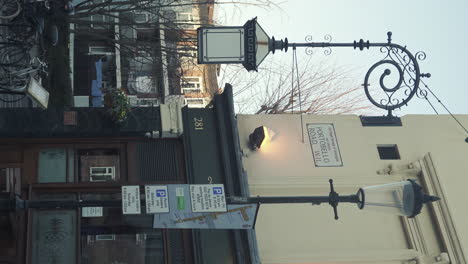 Vertical-Dolly-Left-Shot-Earl-of-Lonsdale-Corner-and-Couple-Walking-in-the-Frame