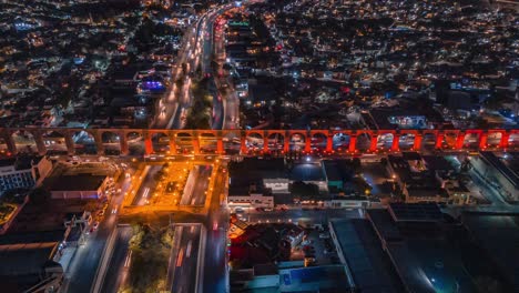 Night-view-of-the-famous-aqueduct-of-the-city-of-Querétaro,-hyper-lapse-with-drone,-4k