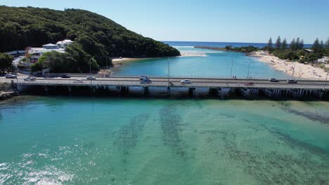 Driving-Across-The-Bridge-Over-Tallebudgera-Creek-In-Burleigh-Heads,-Gold-Coast,-Queensland-Australia