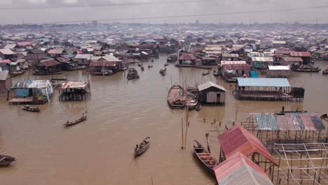 Makoko-Community,-Lagos,-Nigeria---30-June-2024:-Drone-view-of-Makoko-community-across-the-3rd-Mainland-Bridge