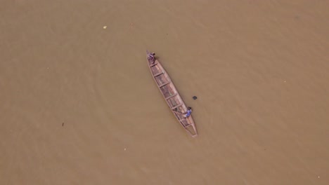 Makoko-Community,-Lagos,-Nigeria---30-June-2024:-Drone-view-of-fishermen-casting-a-net-into-the-Lagoon-in-Makoko-community