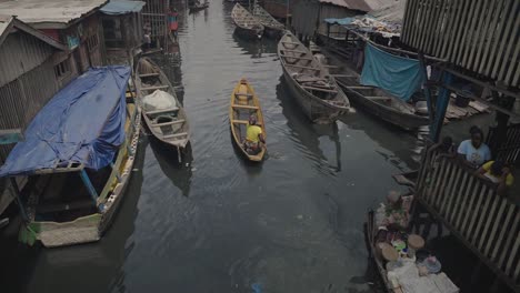 Makoko-Community,-Lagos,-Nigeria---30-June-2024:-Video-of-children-and-people-engaging-in-different-activities-in-Makoko-community-across-the-3rd-Mainland-Bridge