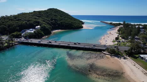 Vehicles-Across-Tallebudgera-Creek-Bridge-On-Sunny-Day-In-Burleigh-Heads,-Gold-Coast,-Queensland-Australia