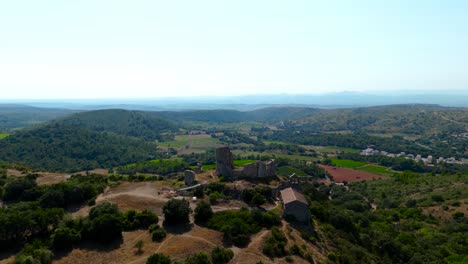 Aerial-orbiting-shot-of-Château-Bas-d'Aumelas-with-surrounding-vineyards