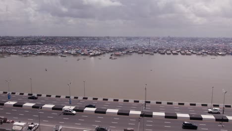 Makoko-Community,-Lagos,-Nigeria---30-June-2024:-Drone-view-of-Makoko-community-across-the-3rd-Mainland-Bridge