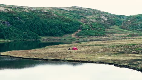 The-Picturesque-Inner-Kjøåkertjønna-Lake-is-Set-Against-a-Backdrop-of-Lush,-Green-Mountainous-Landscape-in-Osen,-Trøndelag,-Norway---Aerial-Drone-Shot