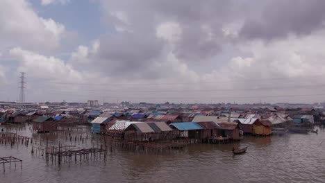 Makoko-Community,-Lagos,-Nigeria---30-June-2024:-Drone-view-of-Makoko-community-across-the-3rd-Mainland-Bridge