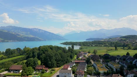 Aerial-shot-of-lake-Thun-in-Switzerland-with-mountain-scenery-in-the-background