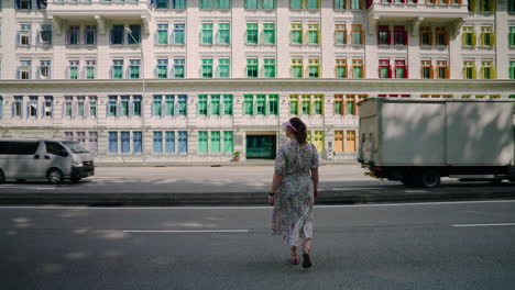 Back-View-Of-Female-Tourist-Walking-Towards-Old-Hill-Street-Police-Station-In-Downtown-Core,-Singapore