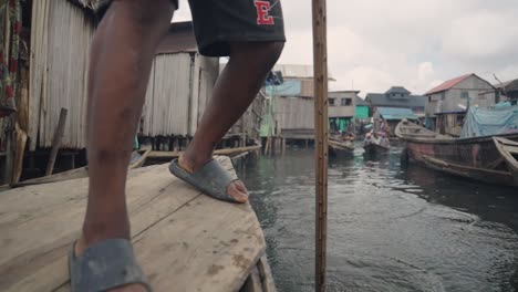 Makoko-Community,-Lagos,-Nigeria---30-June-2024:-Video-of-children-and-people-engaging-in-different-activities-in-Makoko-community-across-the-3rd-Mainland-Bridge