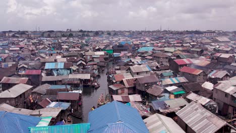 Makoko-Community,-Lagos,-Nigeria---30-June-2024:-Drone-view-of-Makoko-community-across-the-3rd-Mainland-Bridge