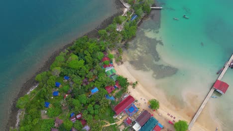 Aerial-view-of-beautiful-village-of-Koh-Rong-Sanloem-island-with-white-sand-beach-and-lush-green-landscape