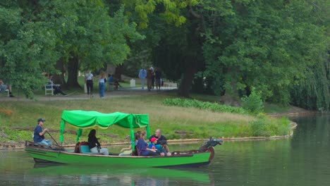 Rowers-dip-oars-with-gentle-rhythm,-each-stroke-a-lullaby-that-ripples