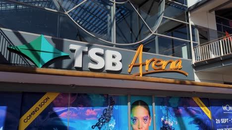 Close-up-of-TSB-Arena-building-with-World-of-WearableArt-WOW-posters-in-capital-city-of-NZ-Aotearoa