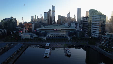 Establishing-drone-shot-of-the-Marvel-Stadium,-golden-hour-in-downtown-Melbourne