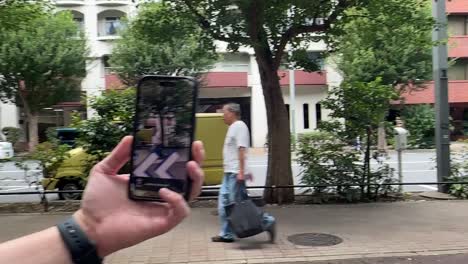 Tourist-Using-Google-Maps-While-Walking-Through-An-Unfamiliar-Neighborhood-In-Asia