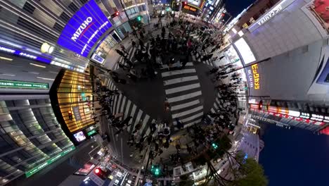 Drone-like-footage-directly-above-looking-down-at-a-busy-pedestrian-crossing-in-Shinjuku-at-night