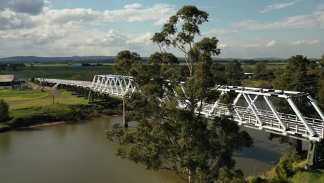 Morpeth-NSW-Drone-shot-flying-over-Hunter-River-towards-bridge