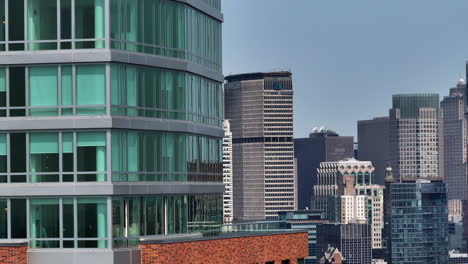 Aerial-view-around-apartment-balcony-and-windows-in-middle-of-high-rise-in-NY