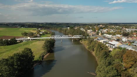 Morpeth-NSW-Drone-shot-flying-over-Hunter-River-towards-bridge