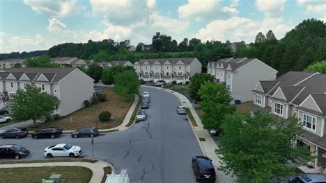 Aerial-birds-eye-shot-of-street-with-parking-cars-in-new-american-neighborhood