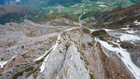 Snow-capped-Concarena-mountain-peak-with-lush-green-valley-below-in-aerial-view