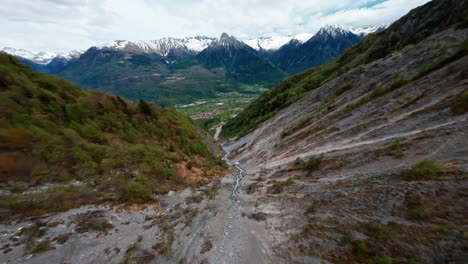 Concarena-mountain-with-lush-valleys-and-snow-capped-peaks,-aerial-view