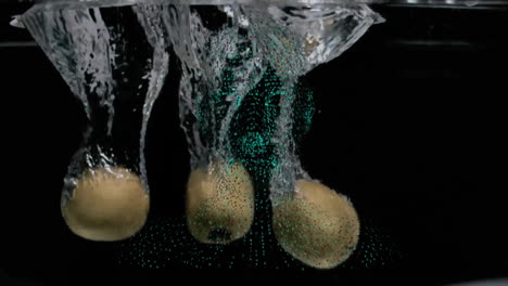 Animation-of-three-lemons-falling-into-water-on-black-background