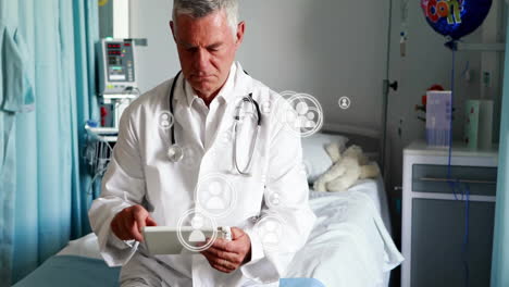 Doctor-using-tablet-with-network-connections-animation-over-hospital-room-background