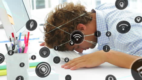 Wireless-network-symbols-animation-over-person-resting-head-on-keyboard-in-office