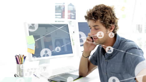 Network-of-connections-animation-over-man-talking-on-phone-at-desk