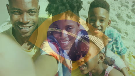 Brazilian-flag-animation-over-smiling-family-taking-selfie-on-beach