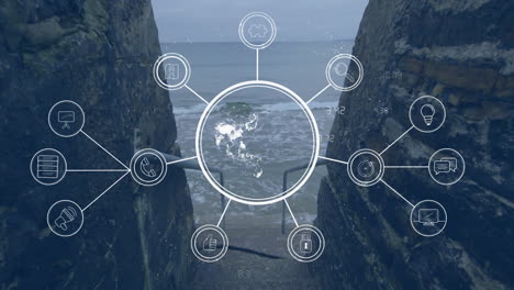 Network-of-interconnected-icons-and-data-processing-animation-over-coastal-landscape