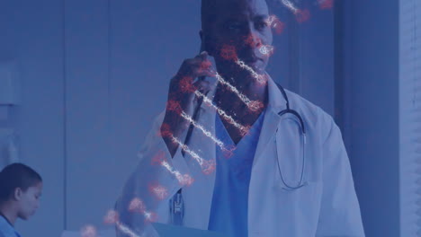 DNA-strand-animation-over-doctor-talking-on-phone-in-hospital