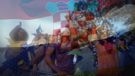 Croatian-flag-animation-over-diverse-group-of-people-celebrating-outdoors